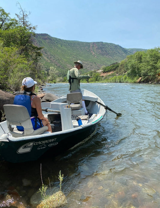Angler fly fishing the Roaring Fork River near Glenwood Springs, Colorado
