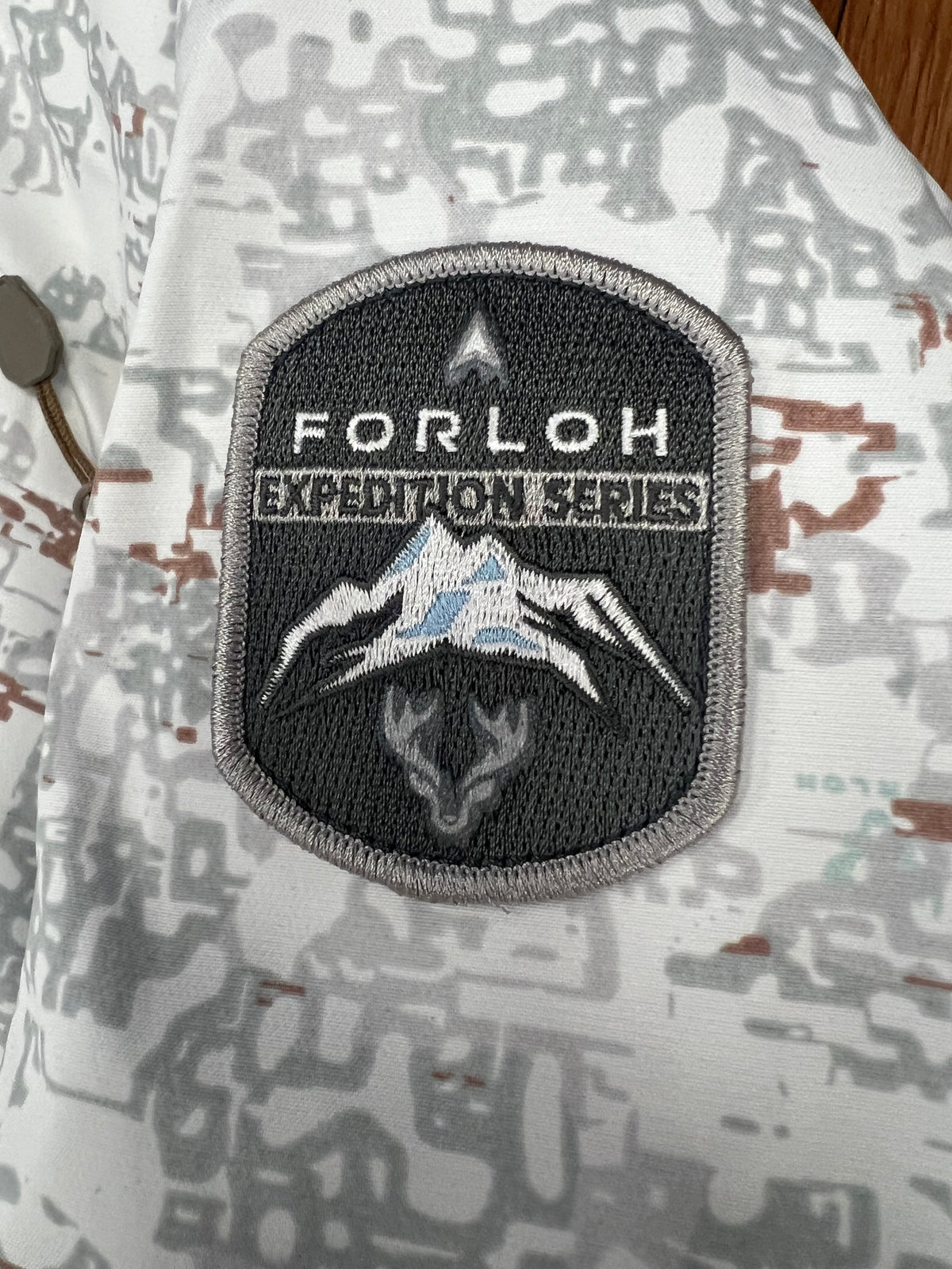 FORLOH Expedition Puffy Jacket in Black — premium down insulated hunting jacket for cold weather, available at Glenwood Springs Outdoors" "FORLOH Expedition Puffy Jacket in White Camouflage — premium down insulated hunting jacket for late season snow hunting, available at Glenwood Springs Outdoors