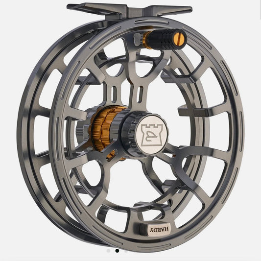 Hardy Averon 5000 large-arbor fly reel in gunmetal grey with open spool, gold drag knob, and Hardy castle logo for 7-9wt fly fishing