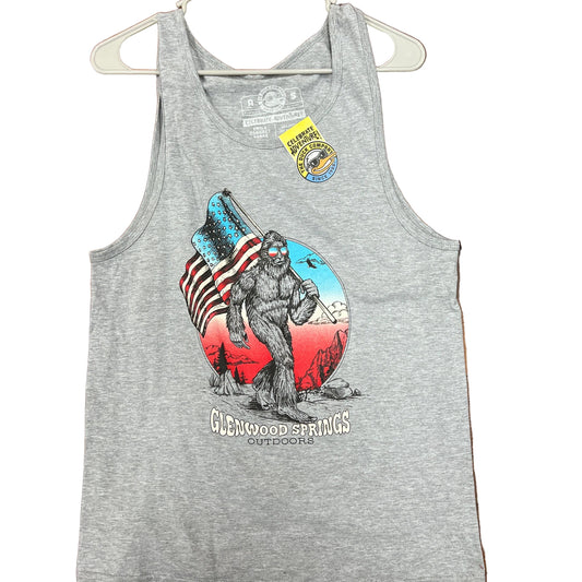 Gray tank top with graphic design on a wooden floor